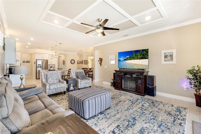 tiled living room featuring ceiling fan, ornamental molding, and coffered ceiling