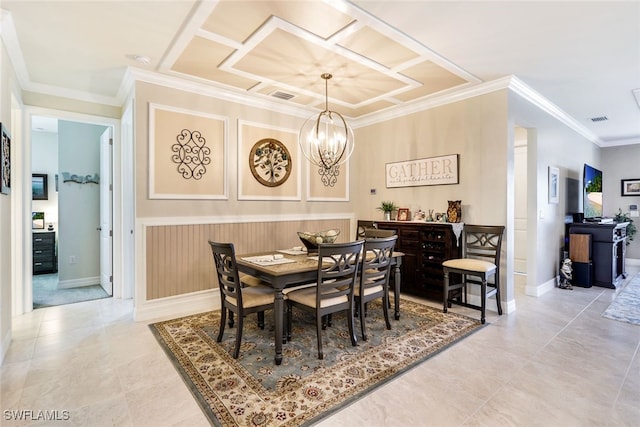 dining area featuring crown molding and a chandelier