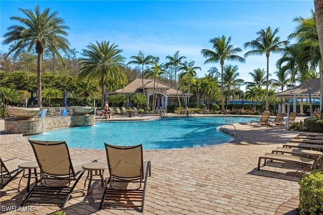 view of swimming pool with a gazebo, a patio area, and pool water feature