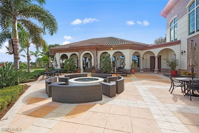 view of patio featuring an outdoor fire pit