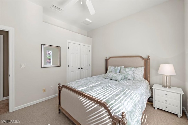 carpeted bedroom with ceiling fan and a closet