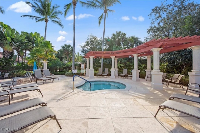 view of pool featuring a pergola, a patio area, and a hot tub