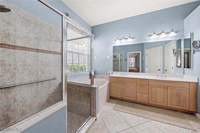 bathroom featuring vanity, separate shower and tub, and tile patterned floors