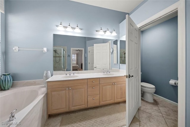 full bathroom featuring tile patterned floors, vanity, toilet, and shower with separate bathtub