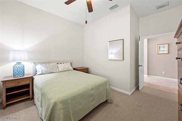 bedroom with ceiling fan and light colored carpet