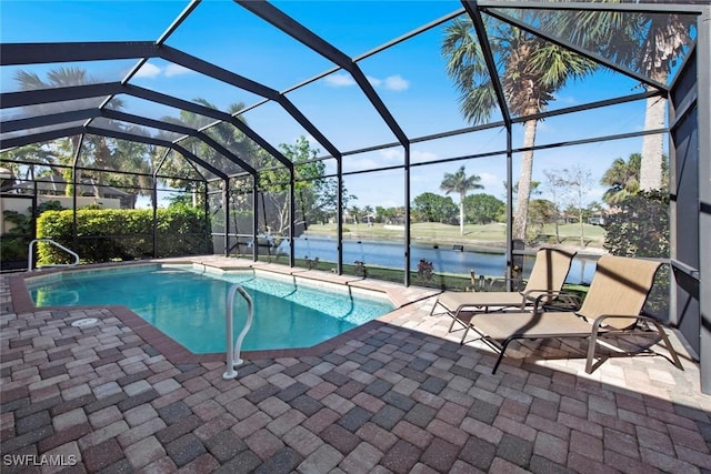 view of swimming pool featuring a patio, a water view, and glass enclosure