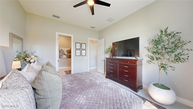 bedroom featuring ceiling fan and ensuite bathroom