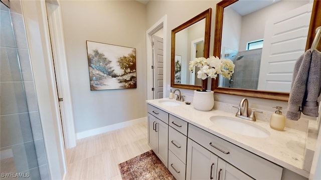 bathroom with a shower and vanity