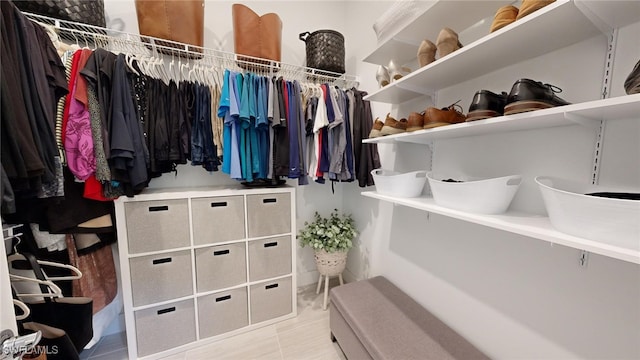 spacious closet featuring light tile patterned floors