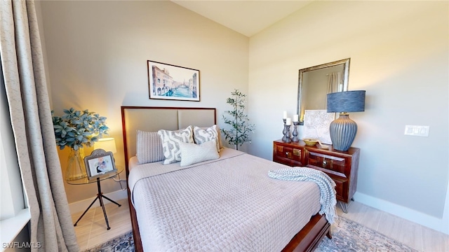 bedroom with hardwood / wood-style flooring