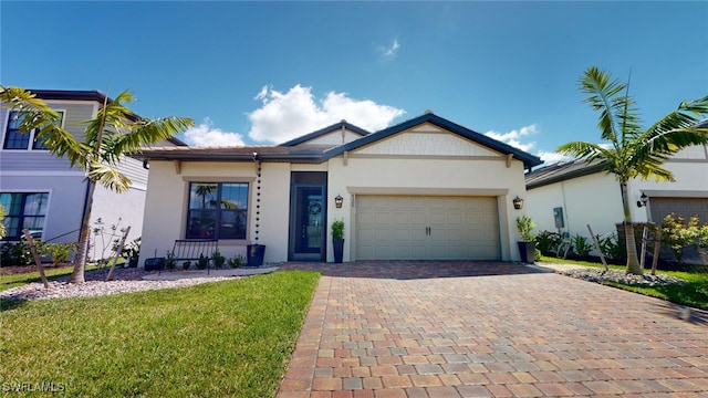 view of front of house with a garage and a front lawn