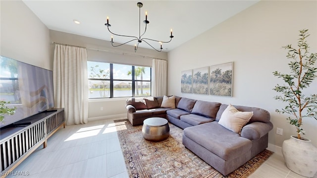 living room with a notable chandelier and a water view