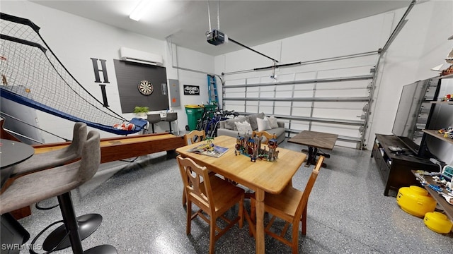 garage with a garage door opener and an AC wall unit