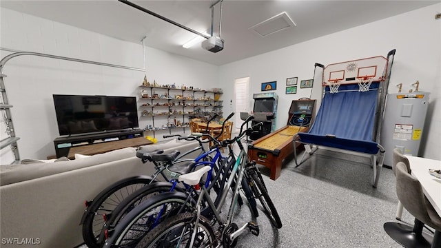 garage featuring a garage door opener and electric water heater