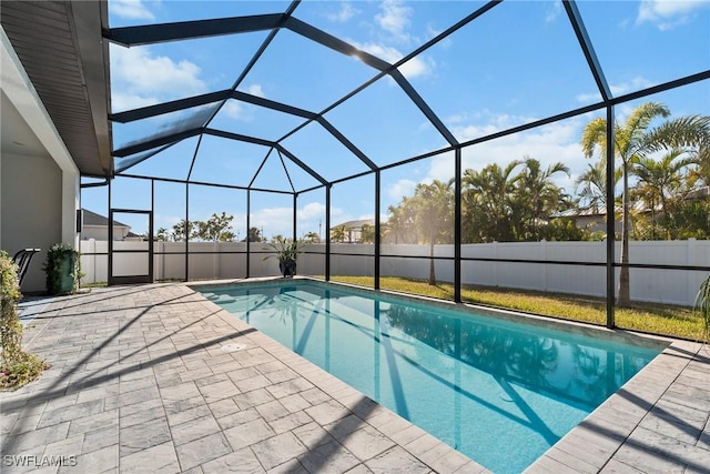 view of pool featuring a patio area and a lanai