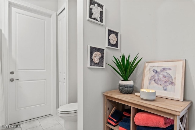 bathroom featuring toilet and tile patterned floors