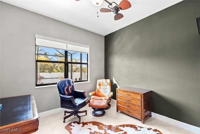 living area featuring ceiling fan and light tile patterned floors