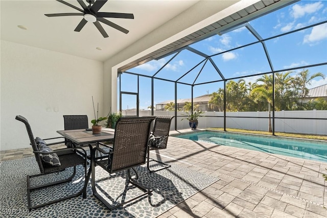 view of patio with a fenced in pool, ceiling fan, and a lanai