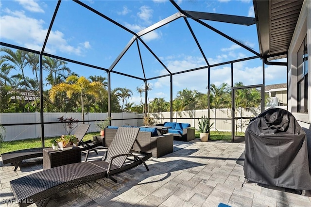 view of patio featuring area for grilling, a lanai, and an outdoor hangout area