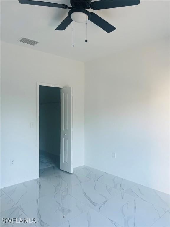 unfurnished room featuring ceiling fan