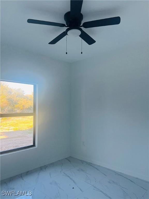 spare room with ceiling fan