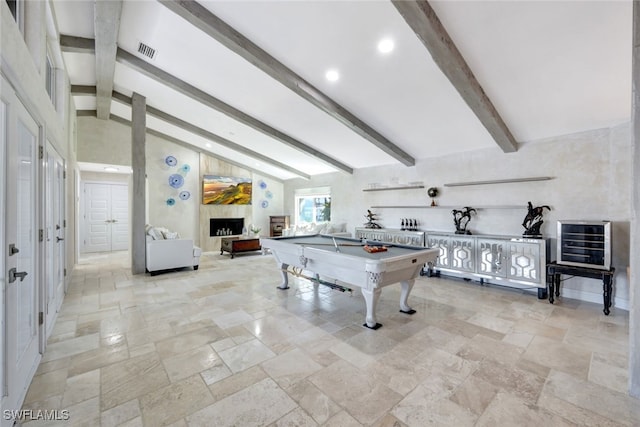 recreation room with vaulted ceiling with beams and pool table