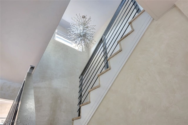 stairs with concrete flooring