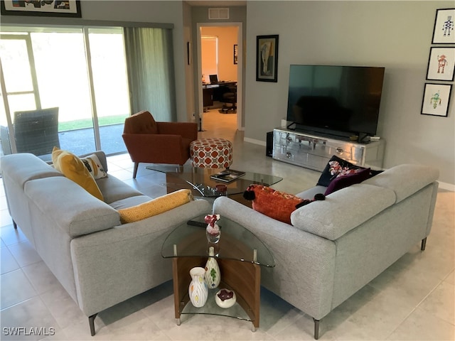 living room with light tile patterned floors