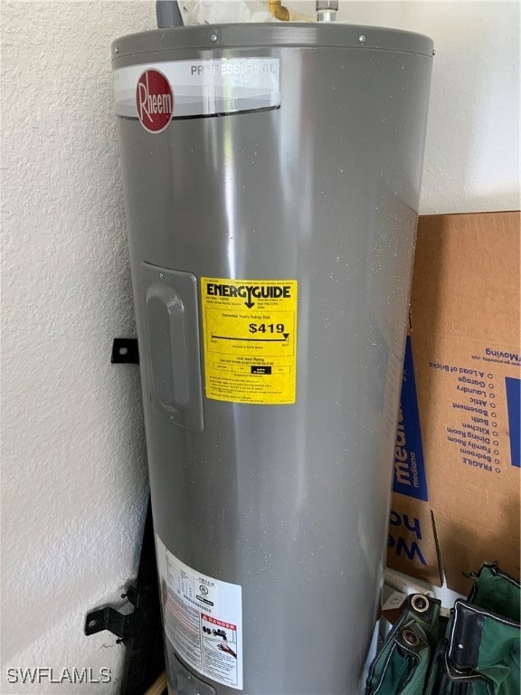 utility room featuring water heater