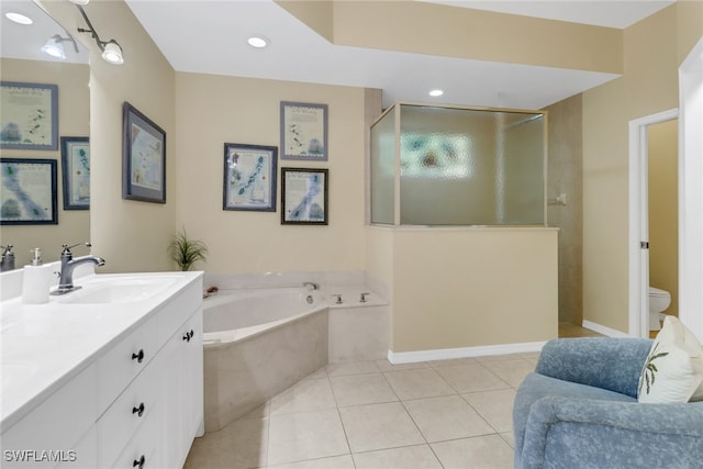 full bathroom featuring toilet, tile patterned floors, plus walk in shower, and vanity