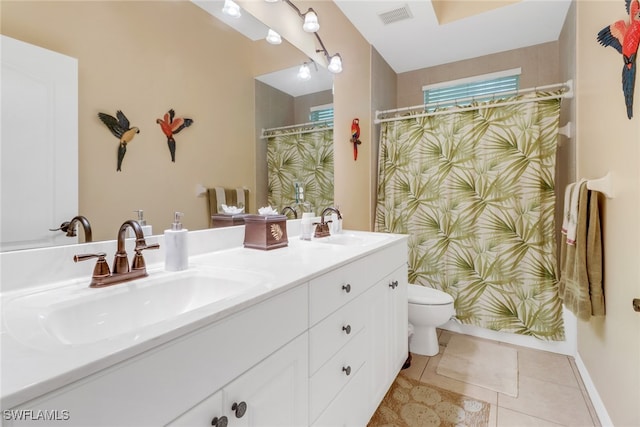 bathroom with vanity, curtained shower, tile patterned floors, and toilet