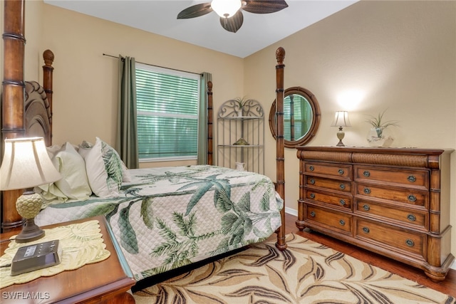 bedroom with hardwood / wood-style floors and ceiling fan