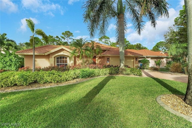 mediterranean / spanish-style house with a front yard