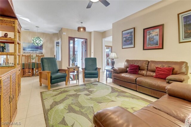 tiled living room featuring ceiling fan