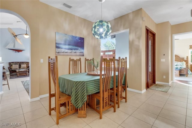 dining space featuring light tile patterned floors