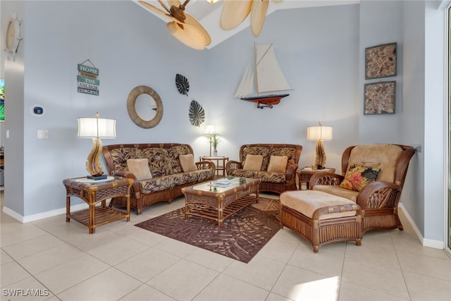 living room with light tile patterned floors, high vaulted ceiling, and ceiling fan