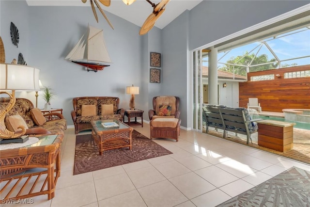 living area with high vaulted ceiling and light tile patterned floors