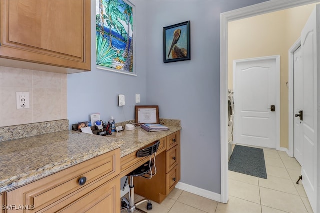 office area with light tile patterned floors