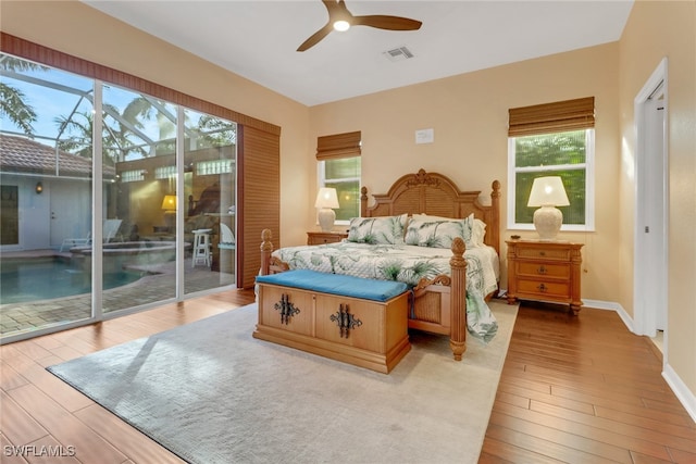 bedroom with ceiling fan, light wood-type flooring, and access to outside