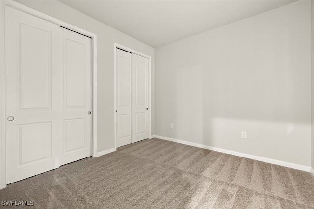 unfurnished bedroom with carpet flooring