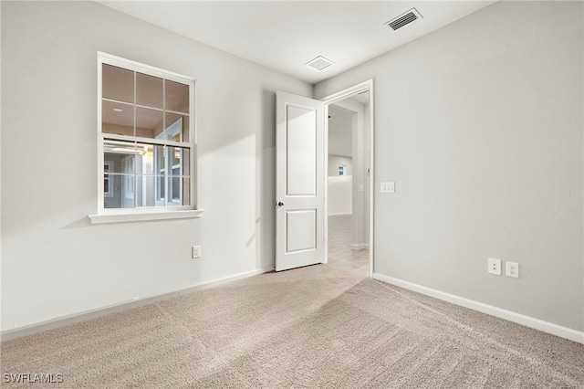 unfurnished room with carpet flooring