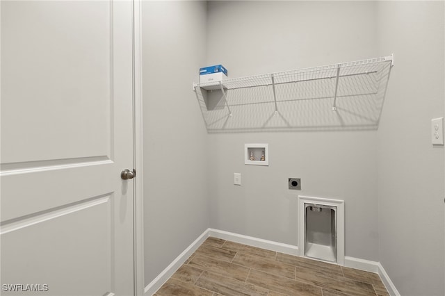 laundry room with hookup for an electric dryer, wood-type flooring, and hookup for a washing machine