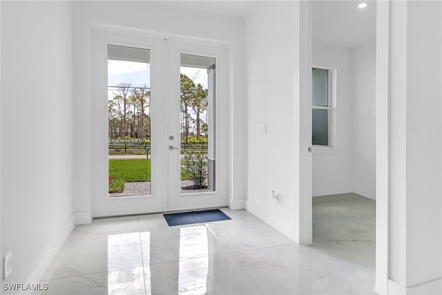 entryway featuring a wealth of natural light and french doors