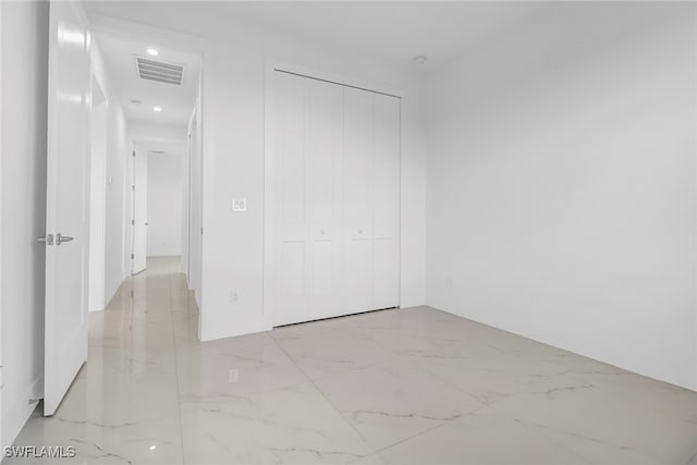 unfurnished bedroom with a closet