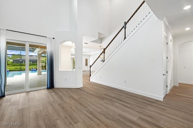 unfurnished living room with wood-type flooring