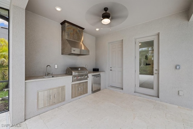 view of patio / terrace featuring a grill, ceiling fan, sink, and an outdoor kitchen