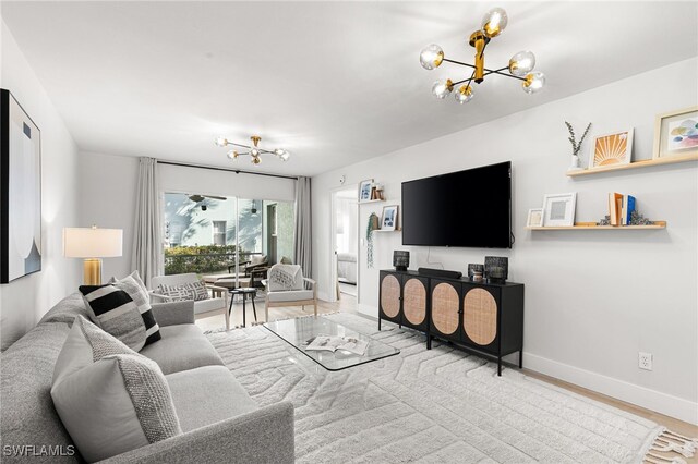 living room featuring hardwood / wood-style floors and a notable chandelier