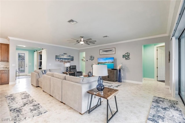 living room with ceiling fan and ornamental molding