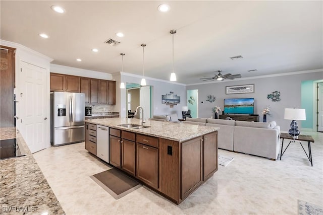 kitchen with ceiling fan, dishwasher, sink, stainless steel fridge, and pendant lighting