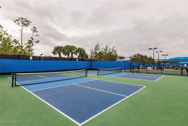 view of tennis court with basketball court